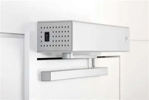 dormakaba ED100 or ED250 electromechanical swing-door operator with slide channel